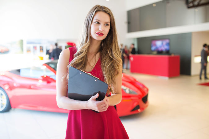 female-model-in-red-dress-carring-notebook