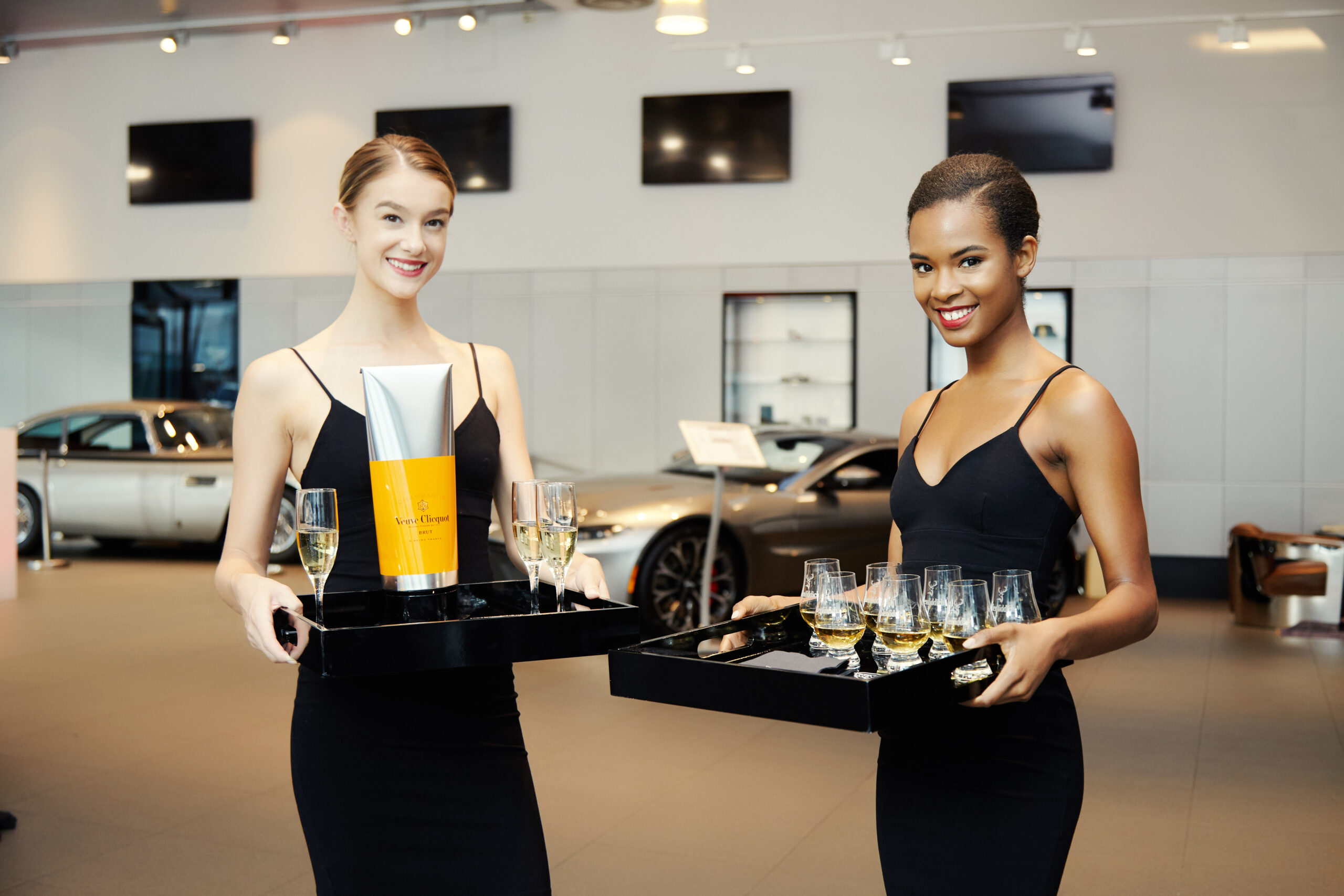 female-in-black-dress-serving-drinks